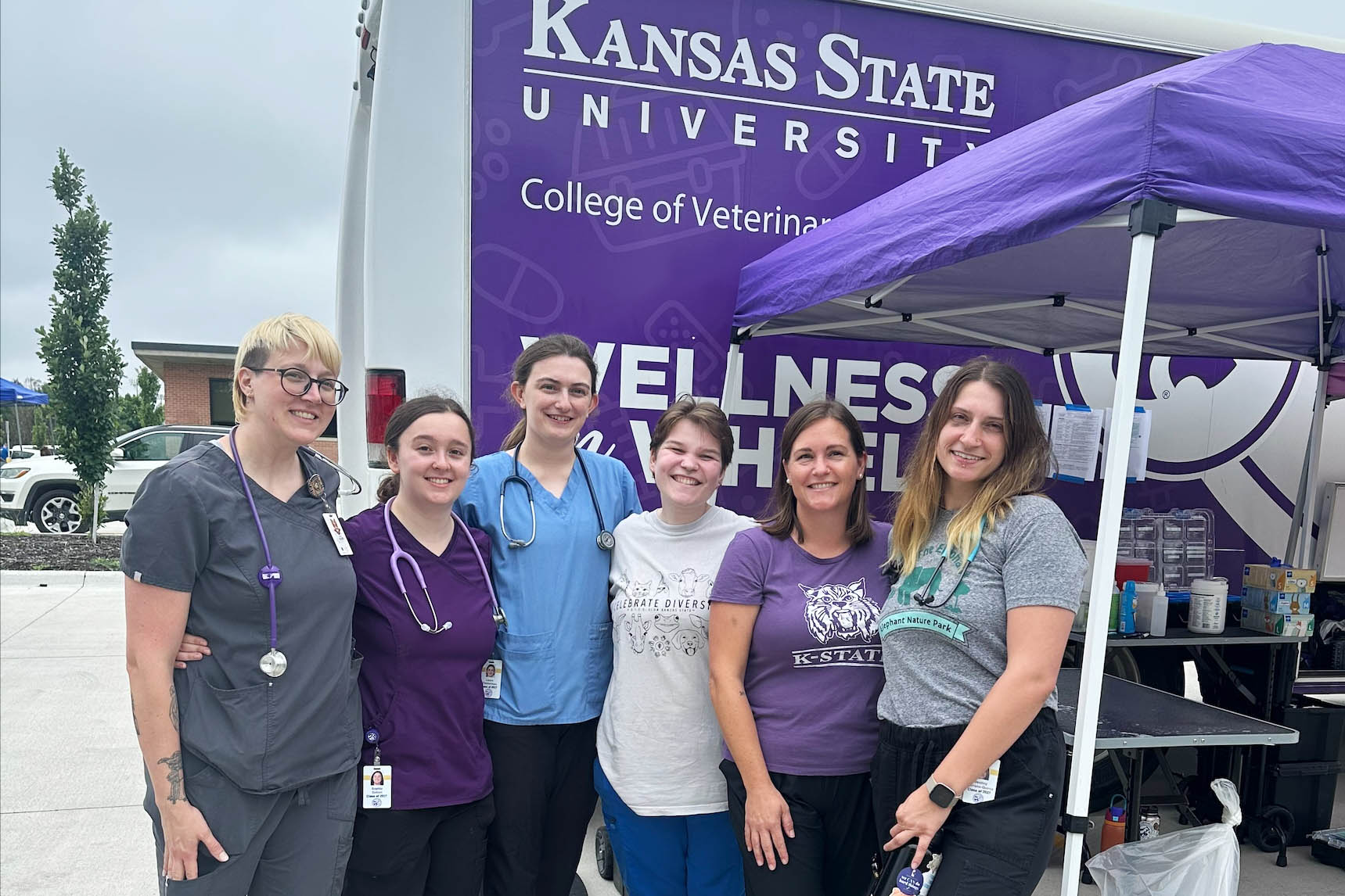 veterinary social work services pictured an an outreach event in front of the Wellness on Wheels vehicle